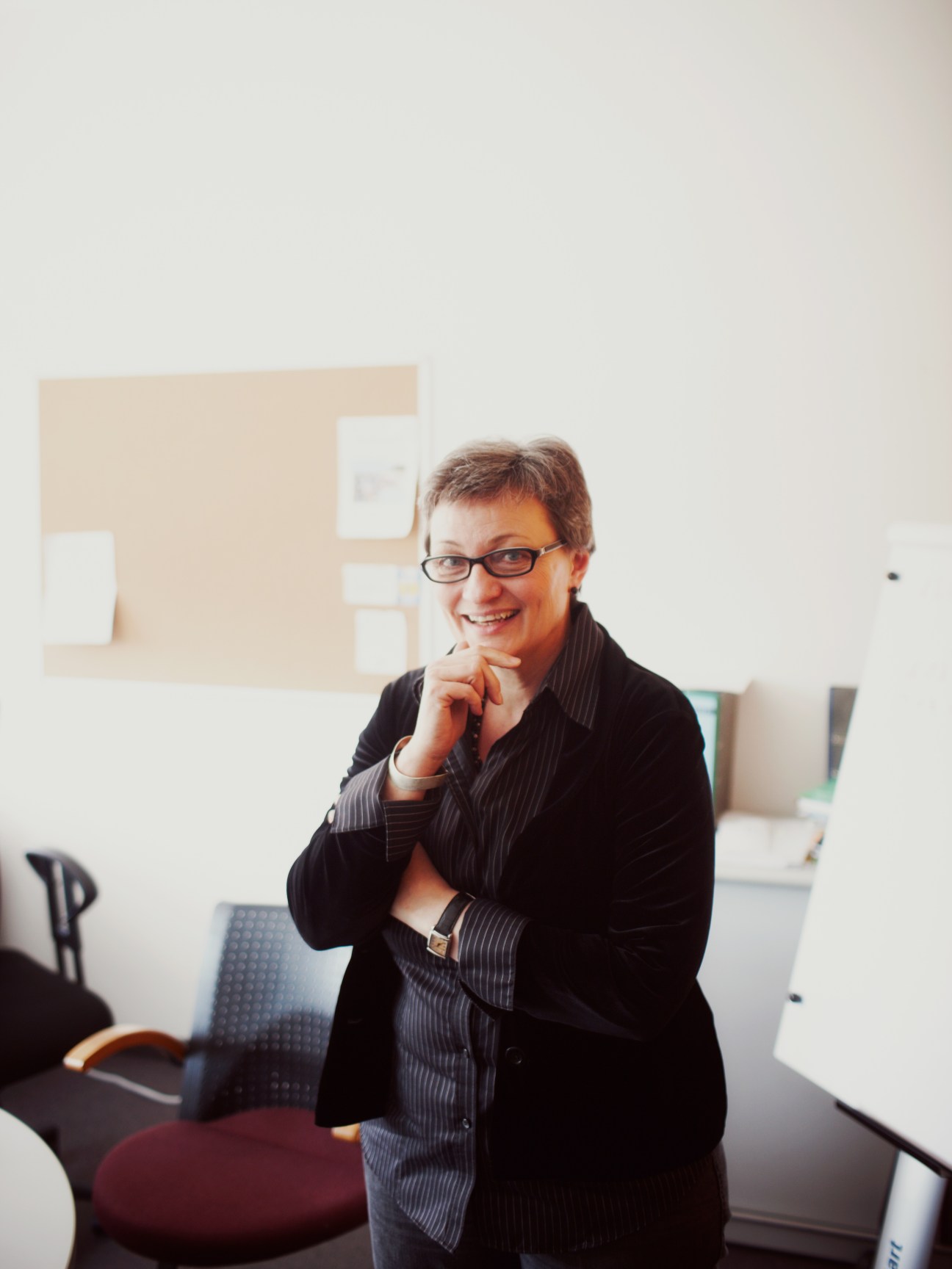 Jutta Voigt, head of language department projects, smiling in a bright office at Goethe-Institut Munich headquarters.