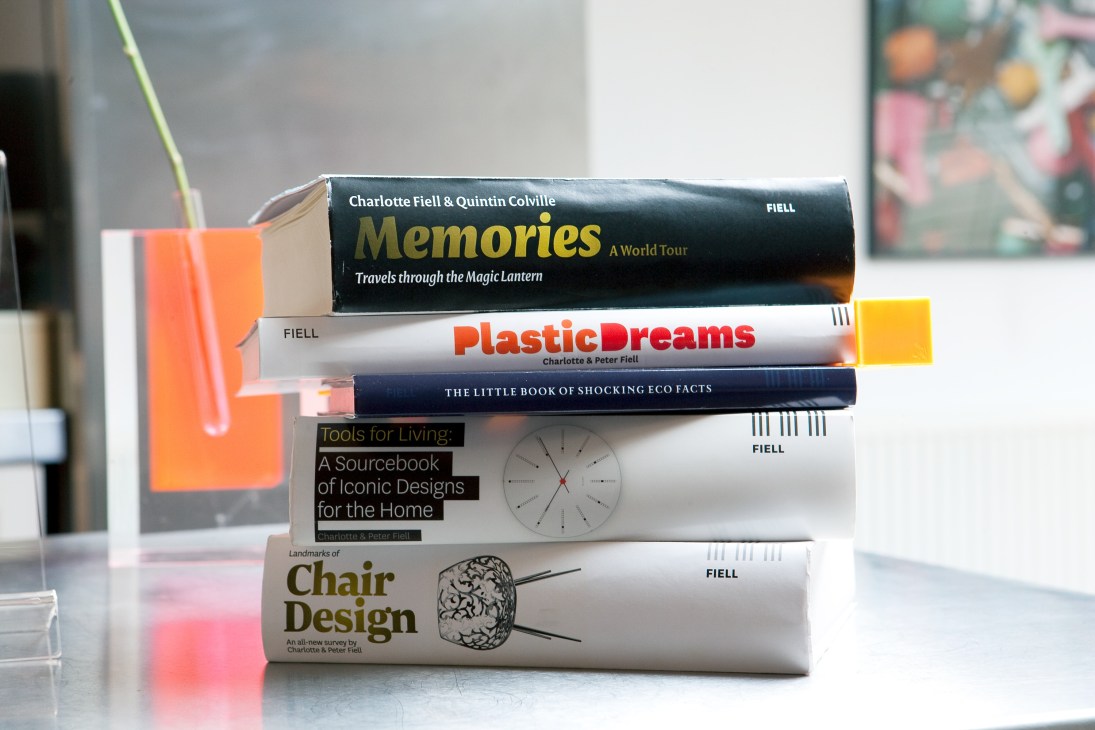 Stack of Fiell publishing books including Memories, Plastic Dreams, Tools for Living, and Landmarks of Chair Design.
