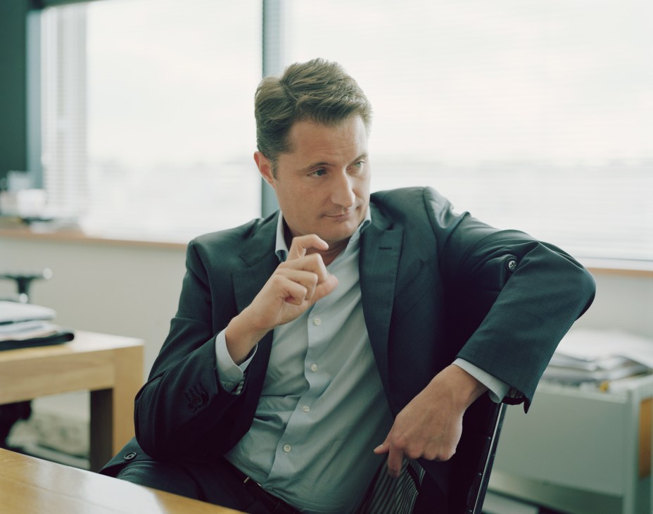 Bert Habets, RTL Nederland CEO, sits in an office gesturing while speaking, wearing a dark blazer and light blue shirt.
