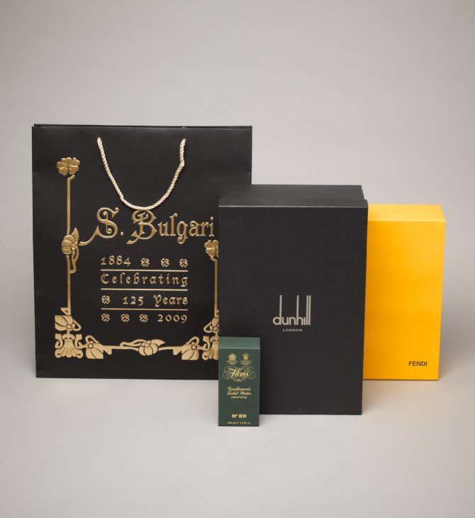 Luxury brand packaging including Bulgari shopping bag, Dunhill box, and Fendi box made from James Cropper paper.