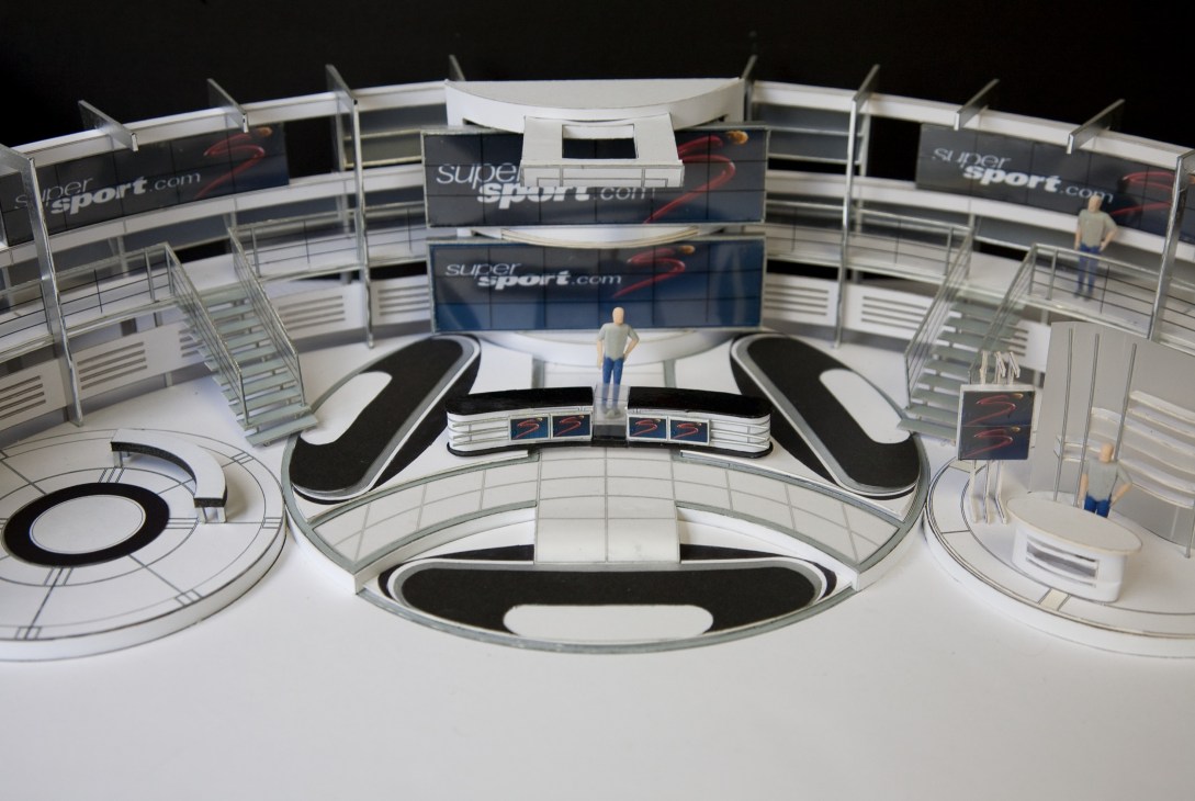 3D model of SuperSport's World Cup studio with branded set, presenter desk and tiered seating areas