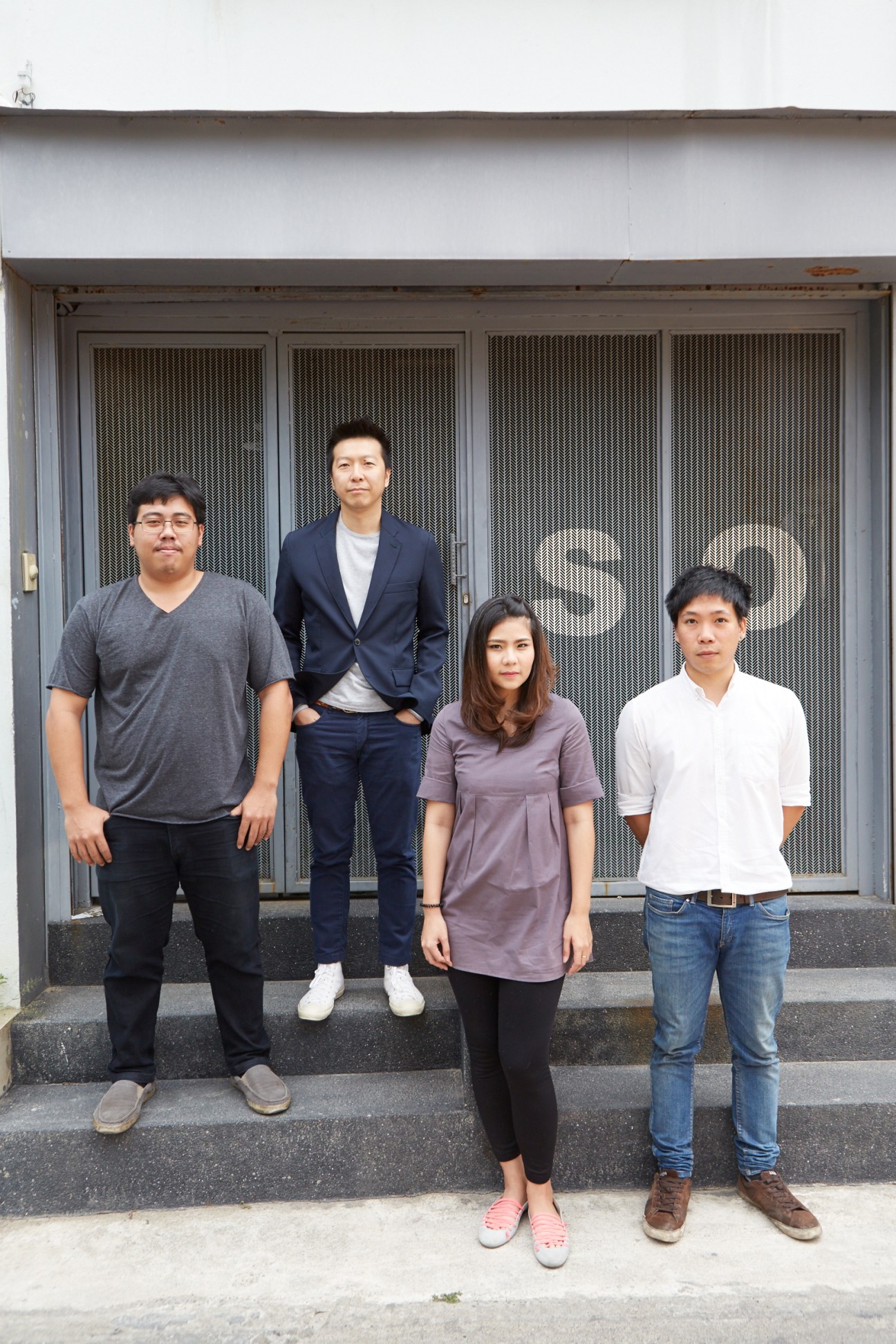 Narong Othavorn and three team members stand outside the So architecture office in Bangkok.