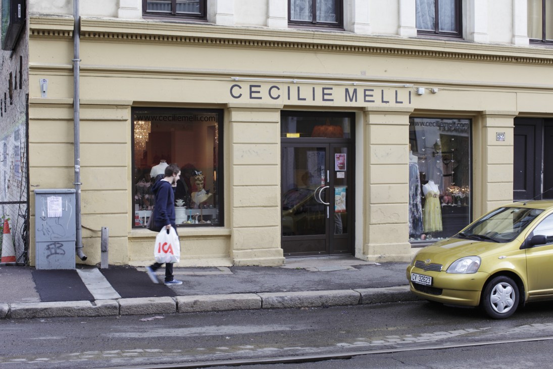 Cecilie Melli fashion designer studio and shop storefront on Thereses gate in Oslo with cream-colored facade and display windows.