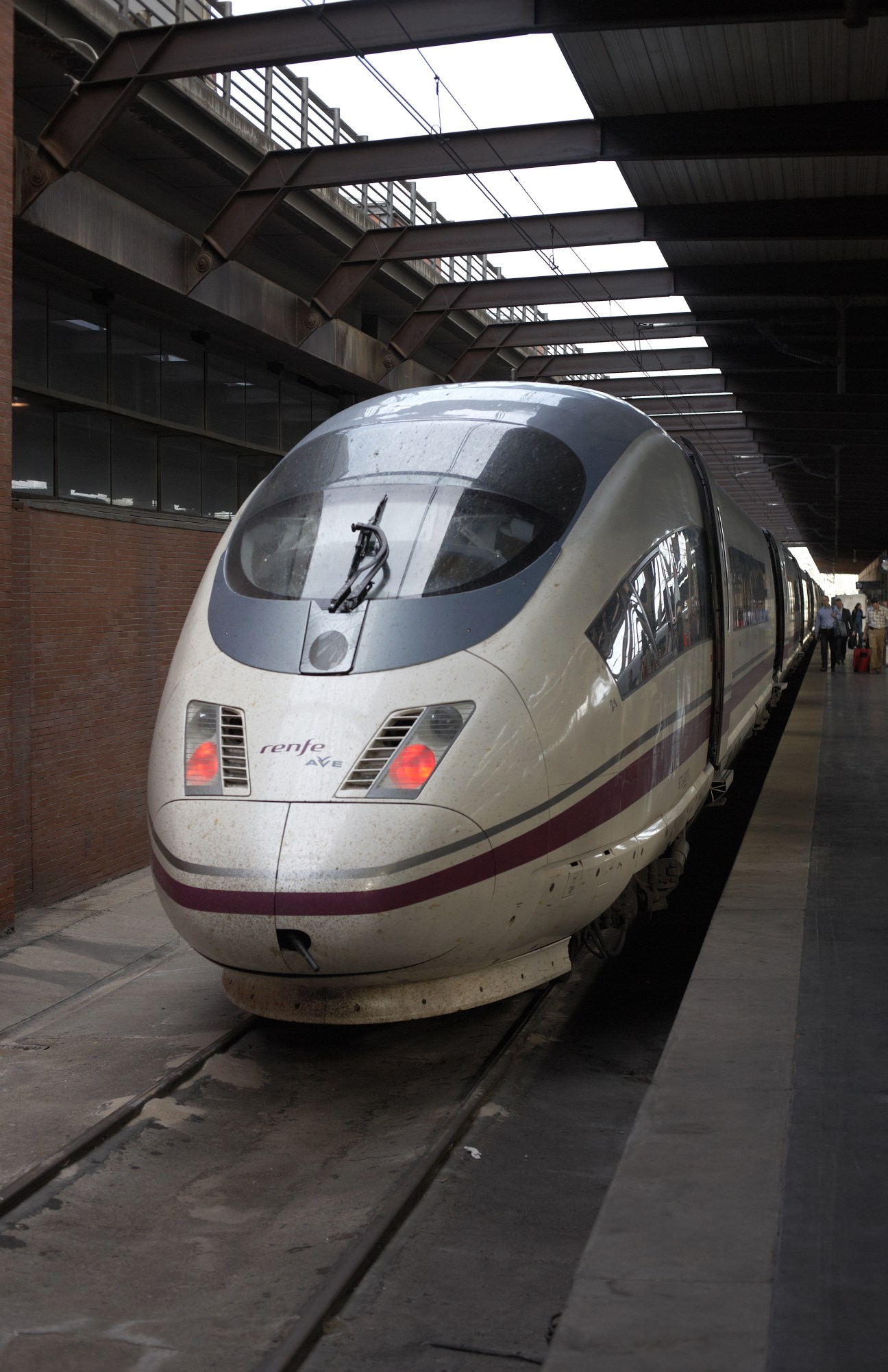 Spanish Renfe AVE high-speed train at Atocha Station platform in Madrid.