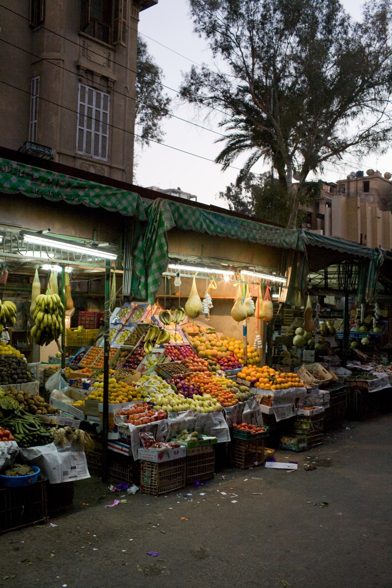 Colorful fruit and vegetable stalls with green awning at Hosni Abd el-Rahim's greengrocers in El Korba, Cairo.