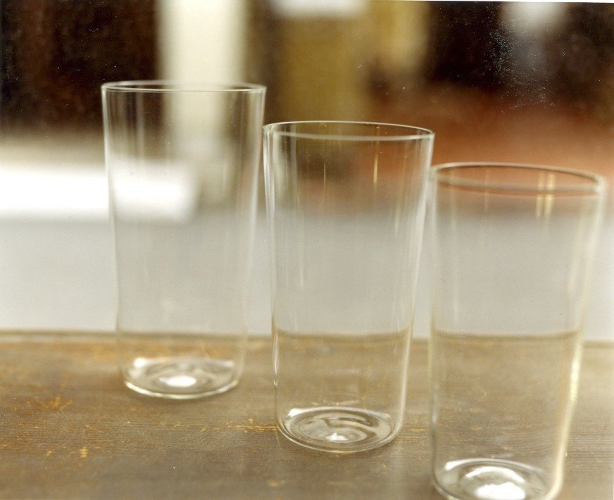 Three ultra-thin Shotoku Usuhari glasses with barely visible rims displayed on a surface.