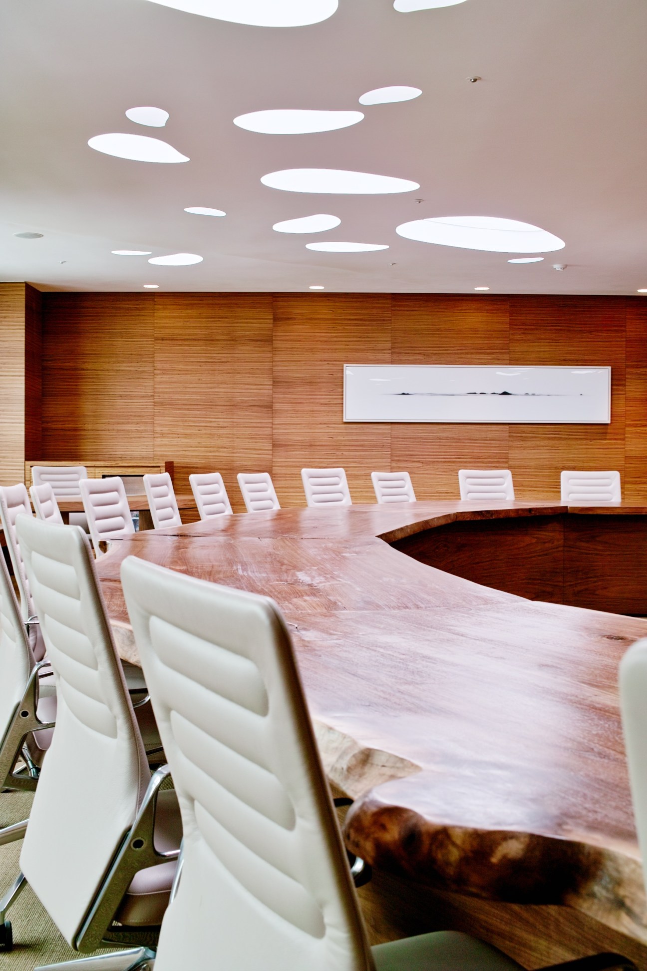 Conference room with custom wooden desk and white AC 4 chairs by Antonio Citterio for Vitra