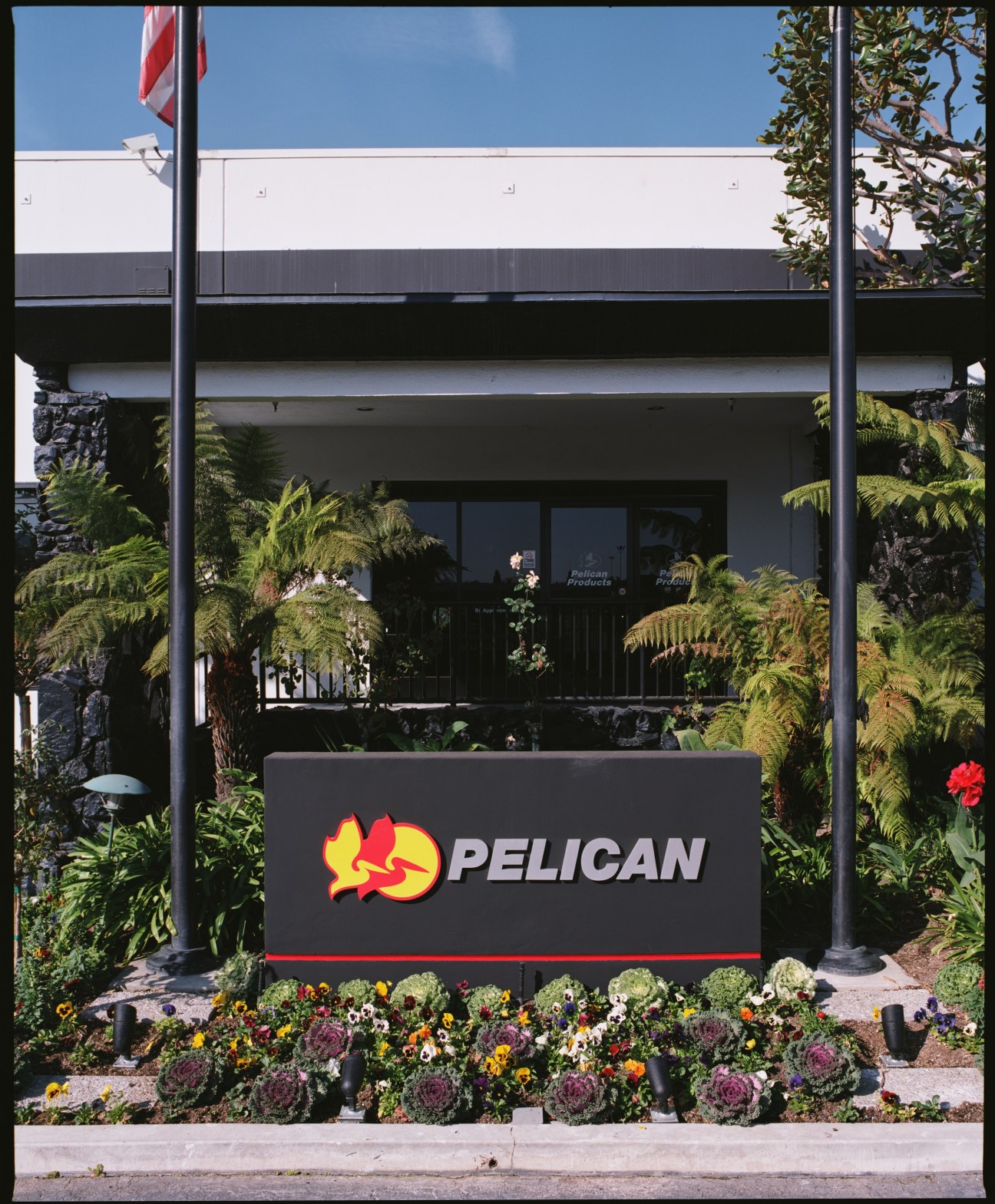 Pelican Products headquarters entrance with logo signage and landscaping in Torrance, California.