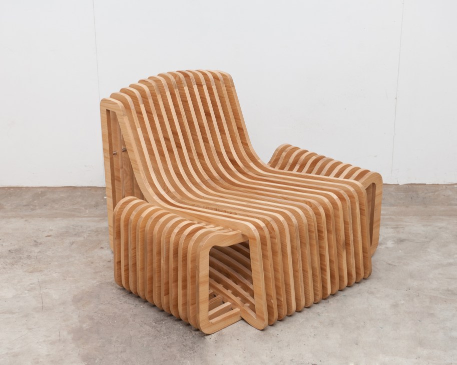 Wooden lounge chair with curved slats by Filipino designer Vito Selma.