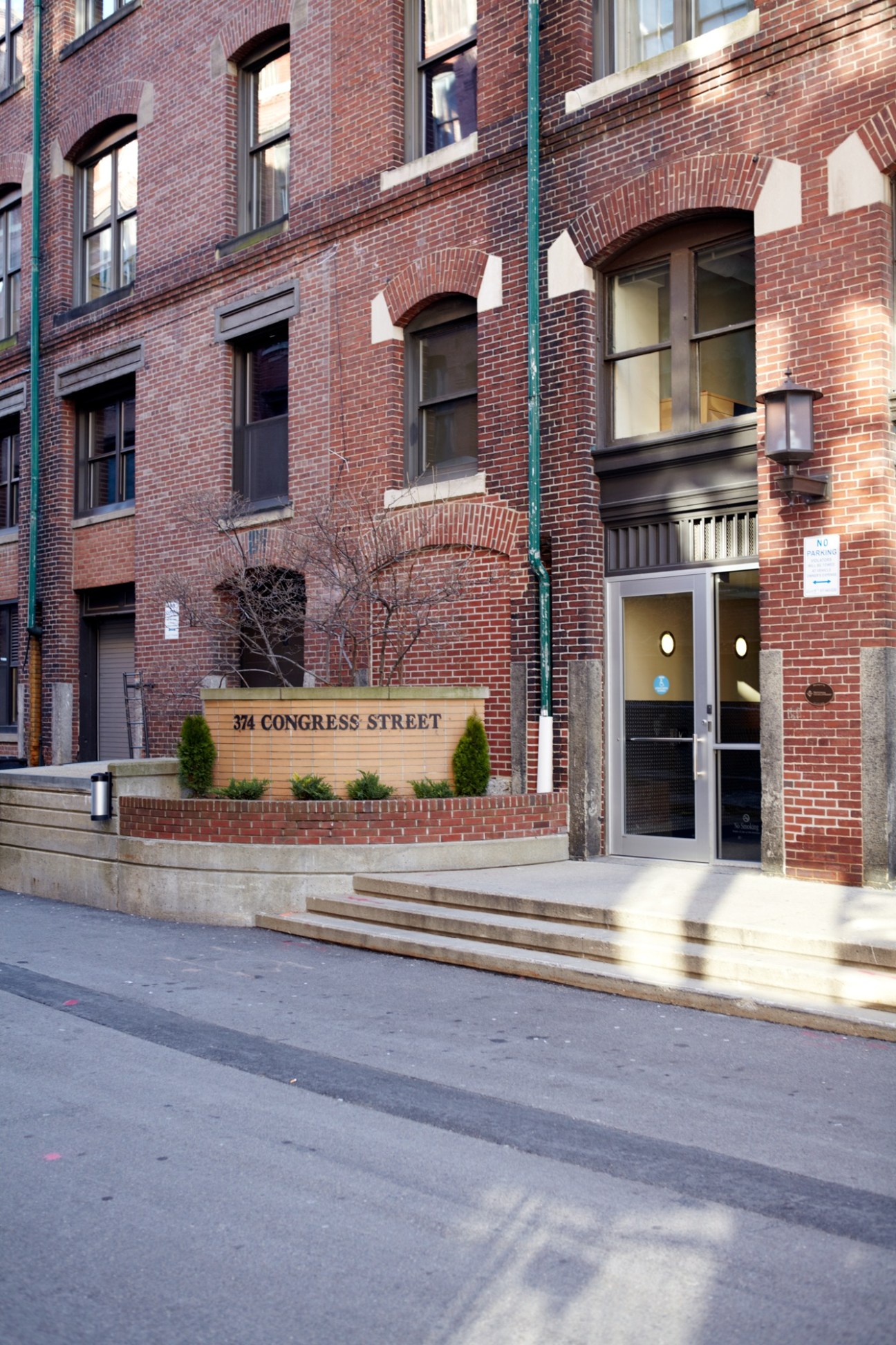 Red-brick warehouse building at 374 Congress Street in Fort Point Channel with modern entrance.