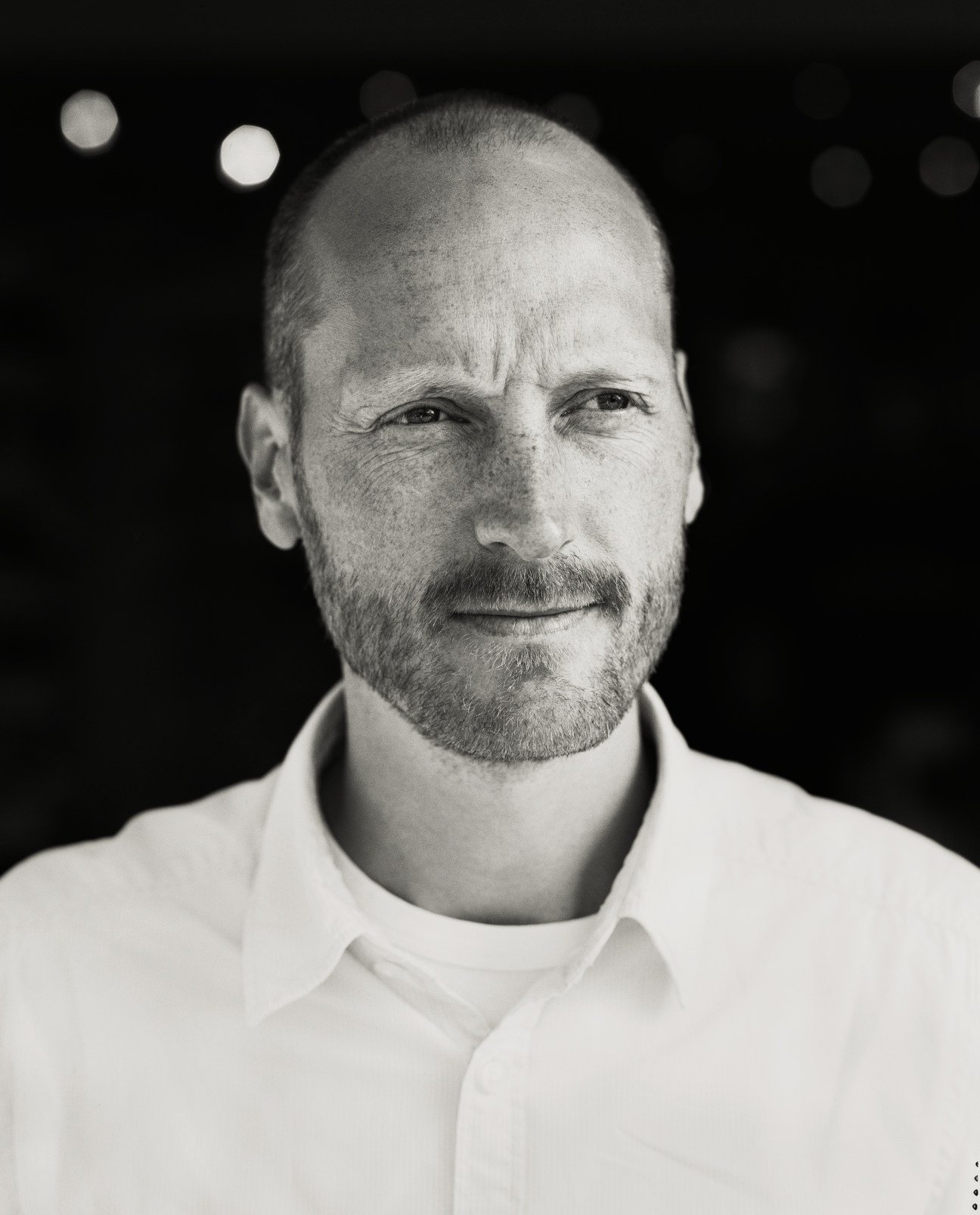 Portrait of Jerk Malmsten, grandson of furniture designer Carl Malmsten, in black and white.