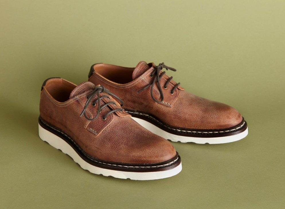 Pair of brown leather Oxford shoes with white rubber soles by Heschung.