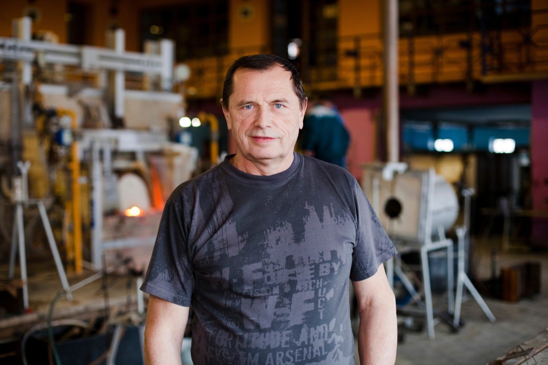 Petr Novotný, glass master and owner of Ajeto glassmaking factory, stands in his workshop.