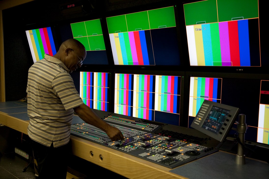Technician operating broadcast equipment in SABC's HD Outside Broadcast truck.