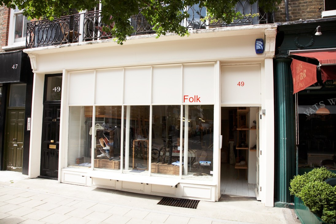 Folk clothing storefront at 49 Lamb's Conduit Street with cream facade and large windows displaying garments.