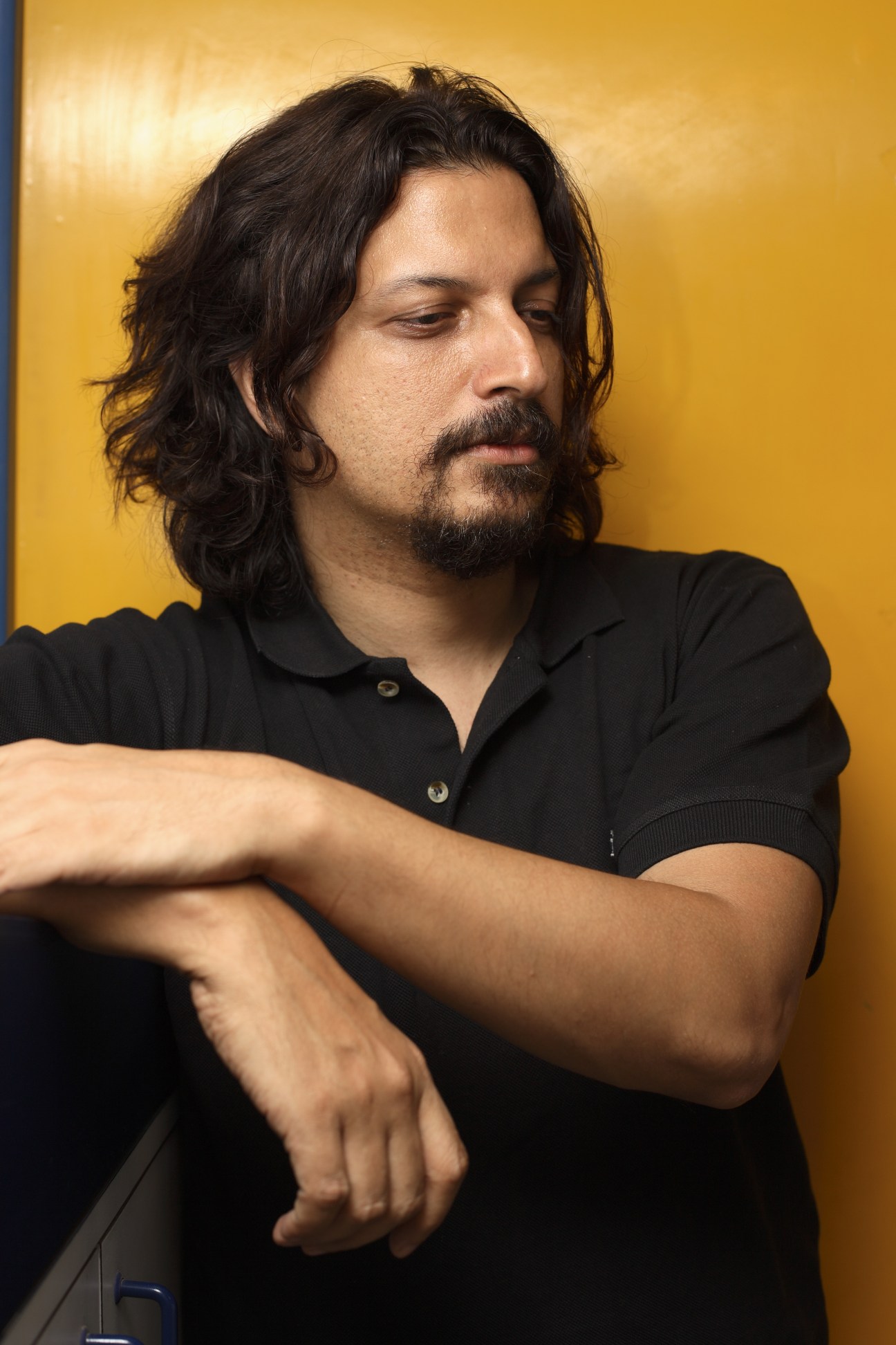 Portrait of Sumanto Chattopadhyay, executive creative director at Ogilvy, against a yellow background.