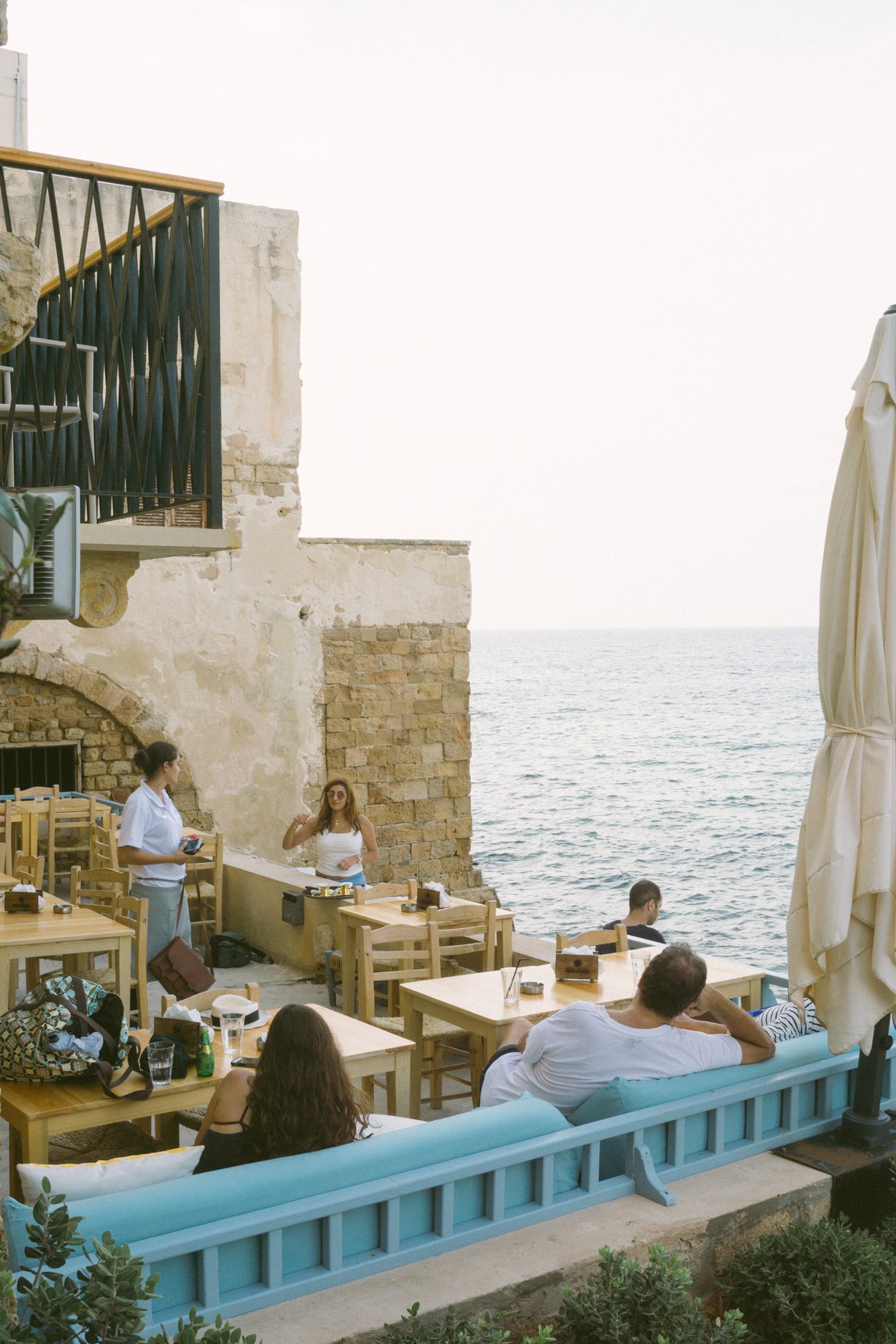 Guests dining at Dar Alma's beachfront restaurant overlooking the Mediterranean Sea in Tyre, Lebanon.