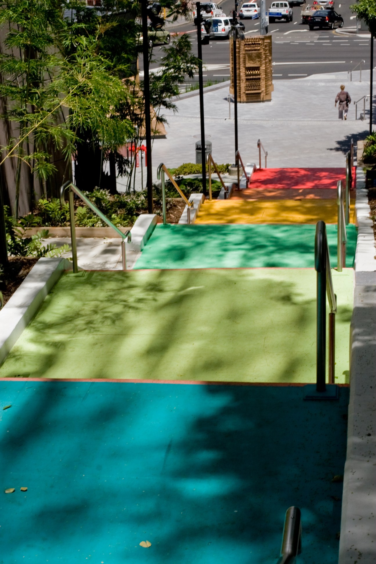 Colorful public art installation 'Jacob's Ladder' with vibrant horizontal stripes in a Brisbane park