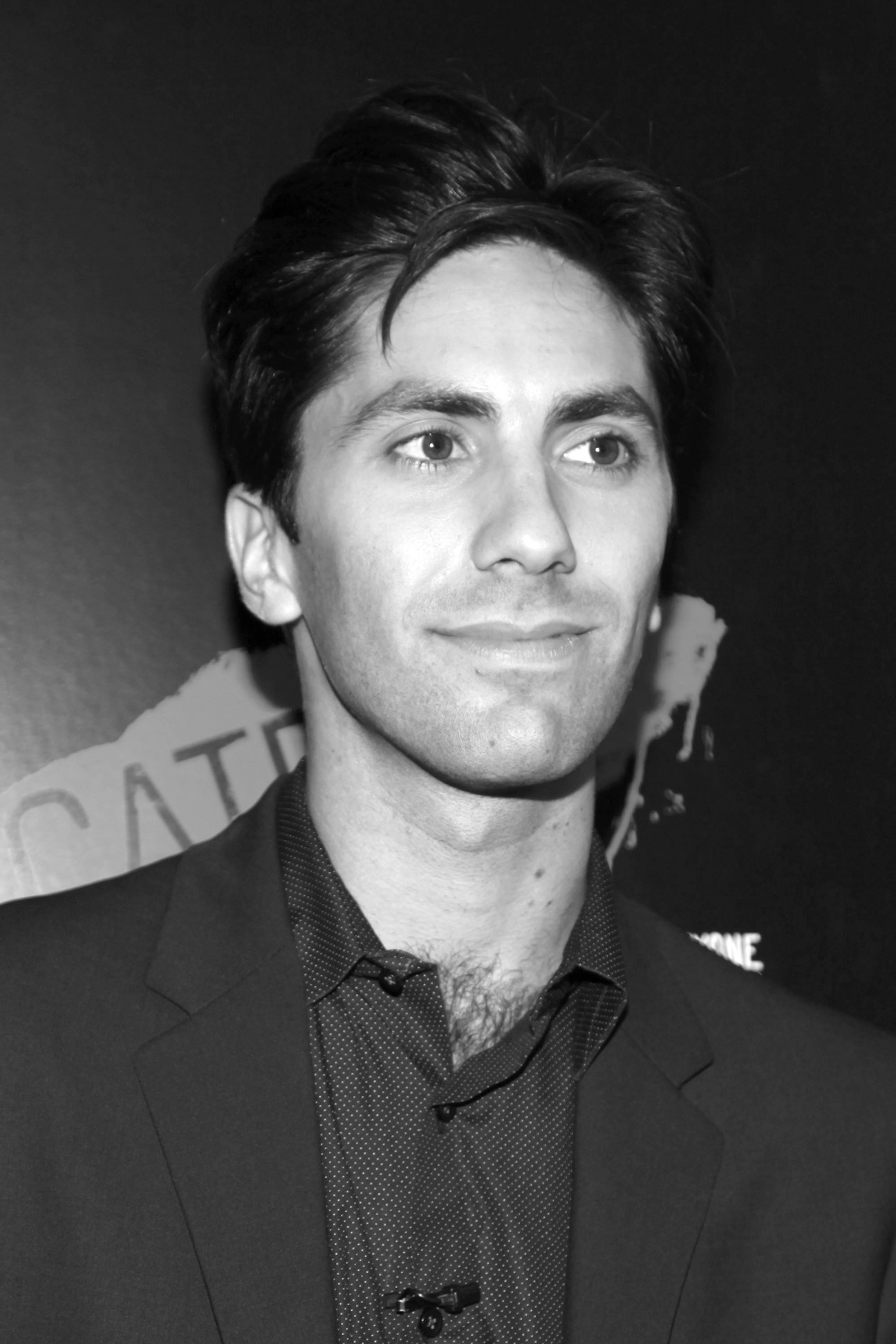 Black and white portrait photograph of a man at an event.