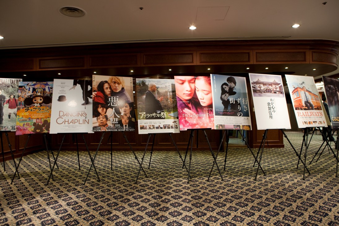 Movie posters displayed on easels promoting Japanese films at the Pusan International Film Festival.