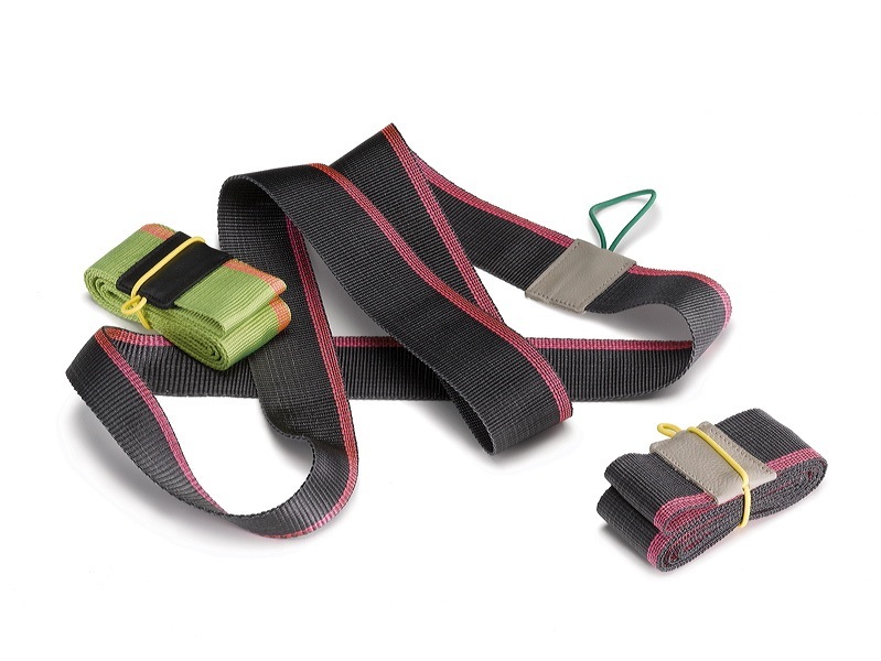 Colorful fabric straps and loops designed for sitting support, including black with pink trim and green with yellow accents.