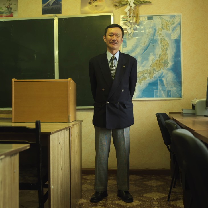 Enamito Yukihiko, Japanese teacher at Kamchatka state university, stands in a classroom.