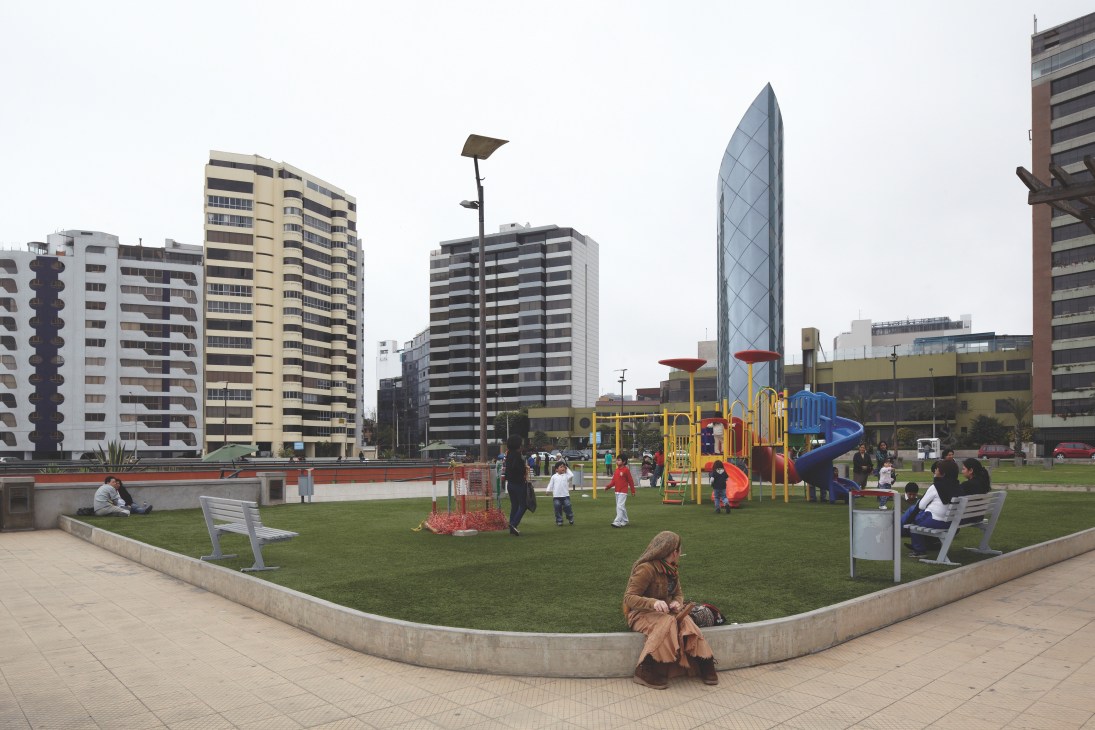 Downtown Lima playground with modern high-rise buildings, children playing, and a woman sitting in the foreground.