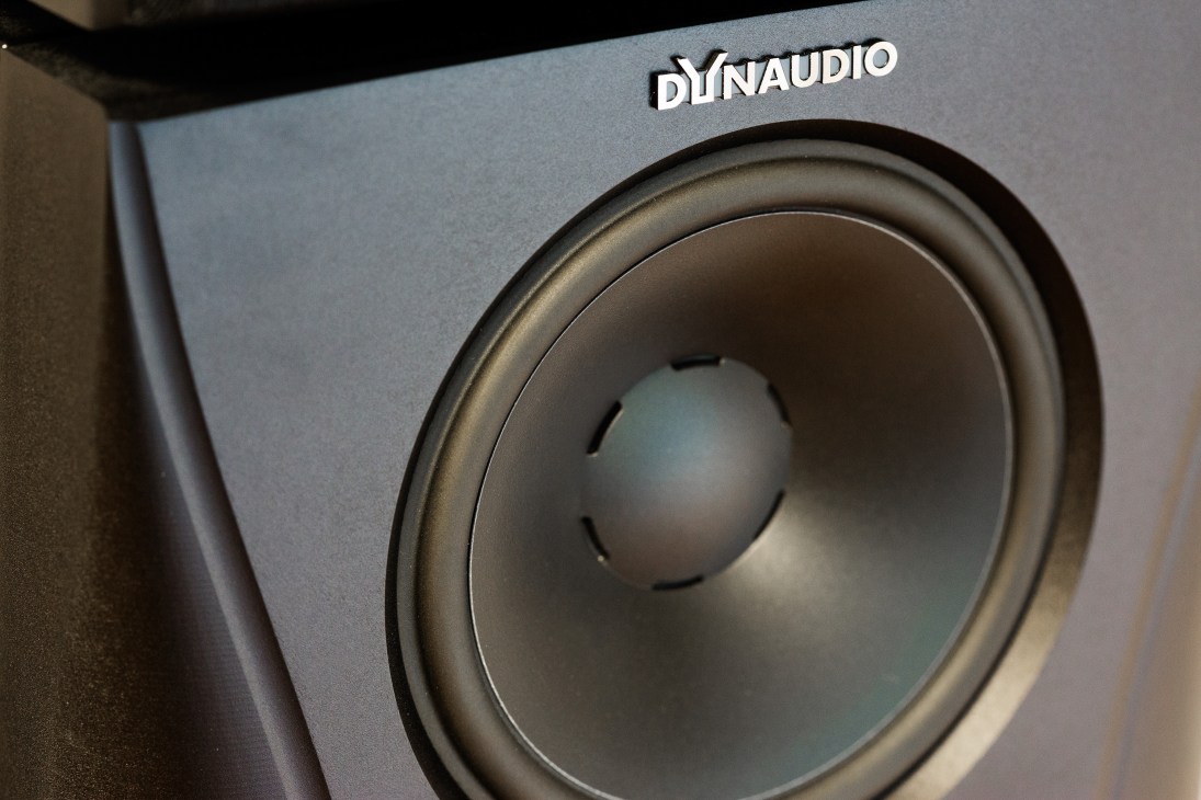 Close-up of a Dynaudio Evidence Master loudspeaker showing its grey cone woofer and branded nameplate.