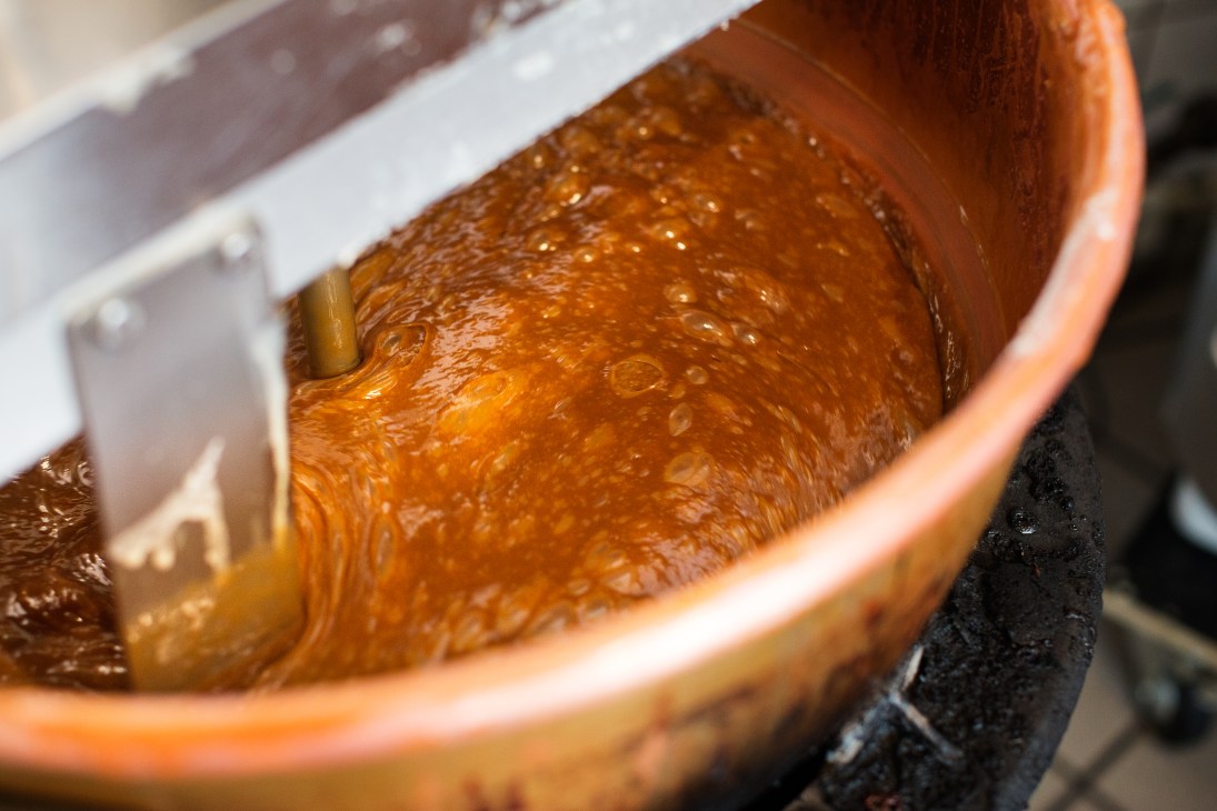 Caramel cooking in a copper pot at Karamelleriet