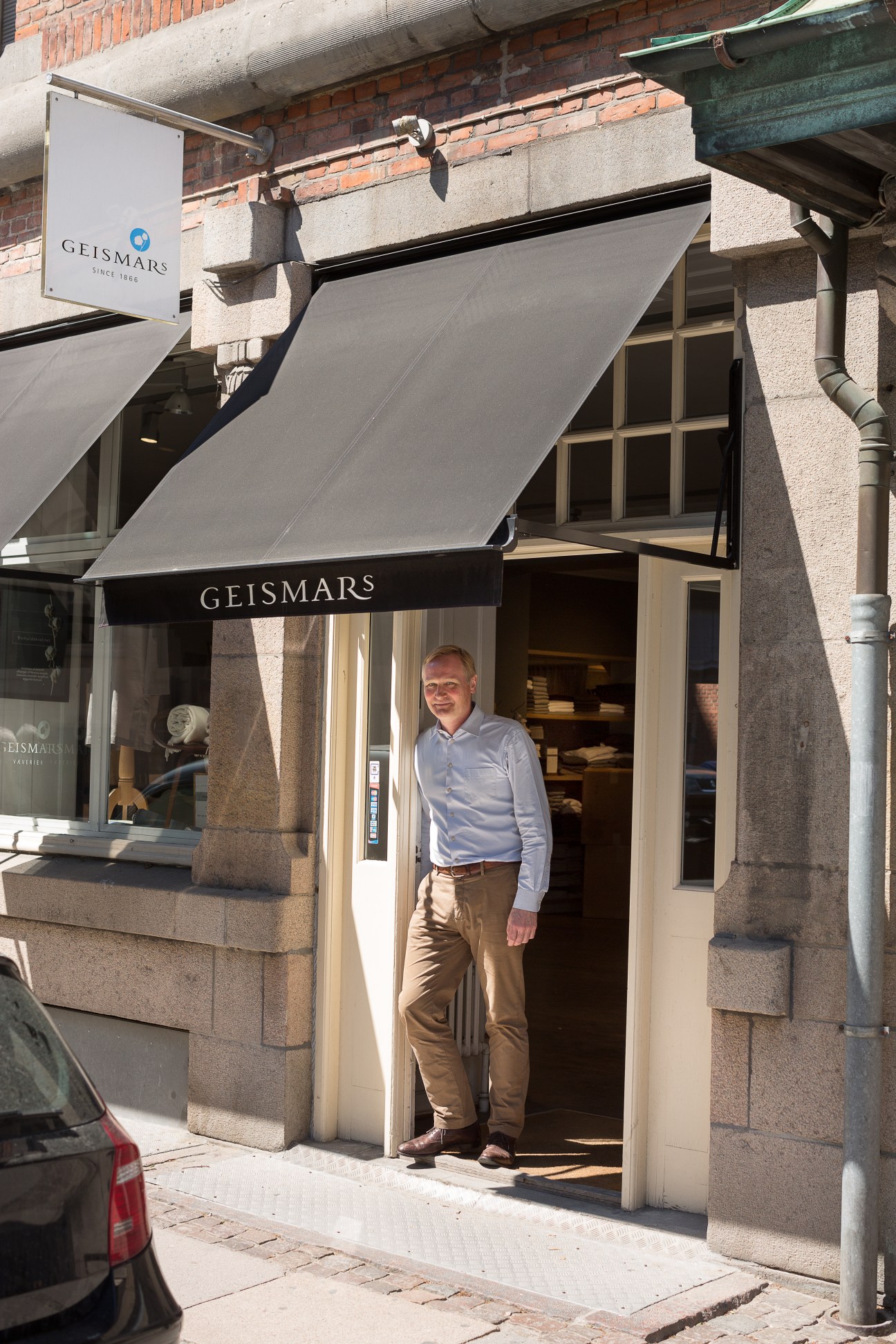 Ulrik Rafaelsen stands in the doorway of Geismars flagship store on Store Strandstraede in Copenhagen.