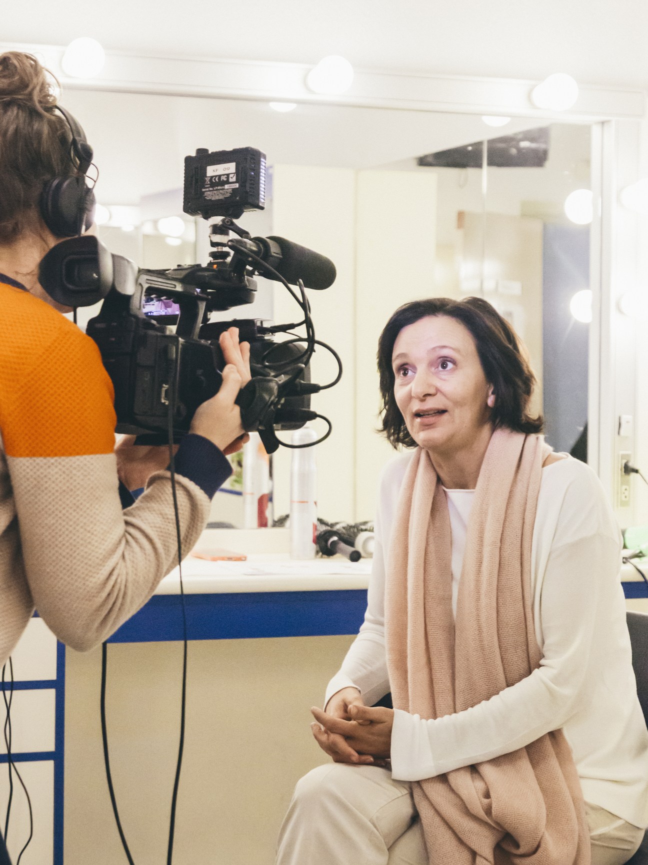 Podemos candidate Carolina Bescansa being interviewed on camera during a television broadcast.