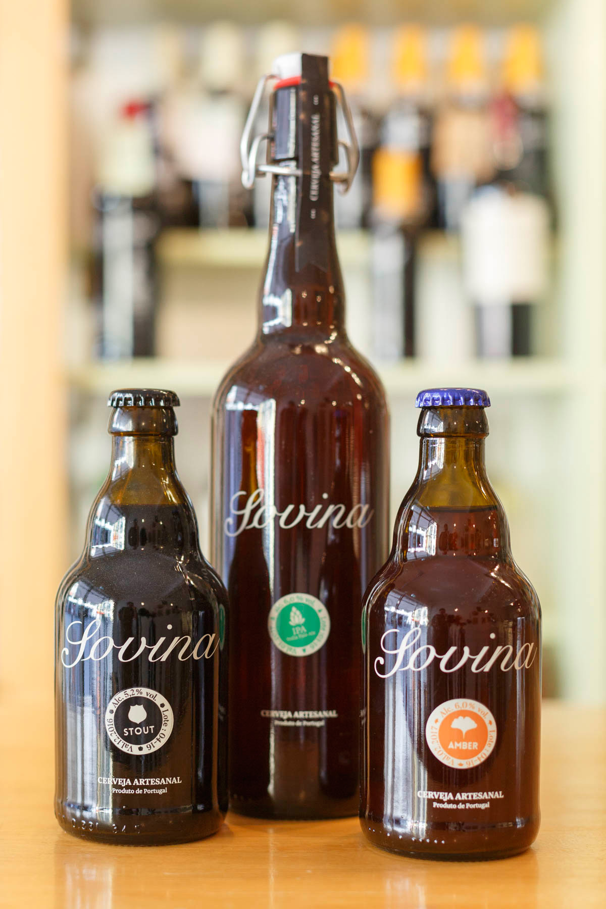 Sovina craft beer bottles displayed at Mercearia das Flores in Porto, Portugal.