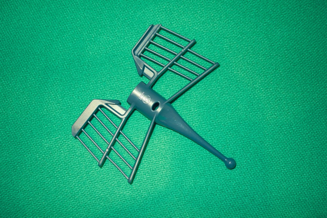 Thermomix machine attachments displayed on a green textured background.