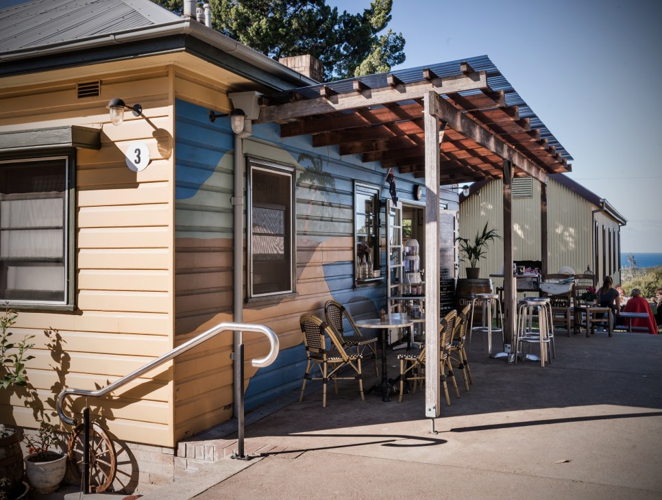 Michael Auden of Sydney Photography School at Headland Park with cafe seating and harbor views.
