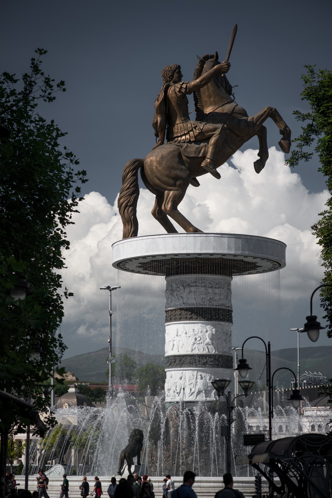 Bronze equestrian statue of a warrior with sword on tall column in Macedonia square, Skopje