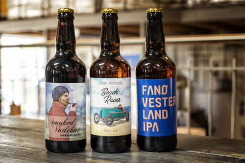 Three beer bottles from Fanø Bryghus brewery with different labels including Smoked Nordkyst and Fanø Vesterkyst IPA