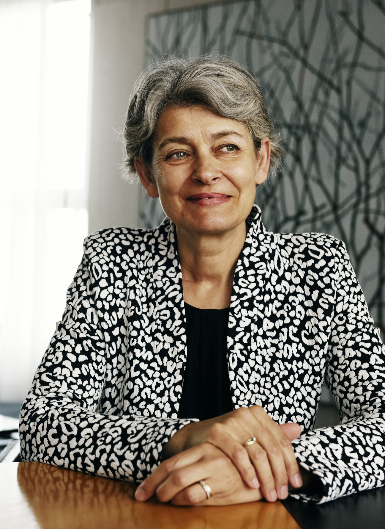 Irina Bokova, director-general of UNESCO, smiling in a patterned black and white jacket