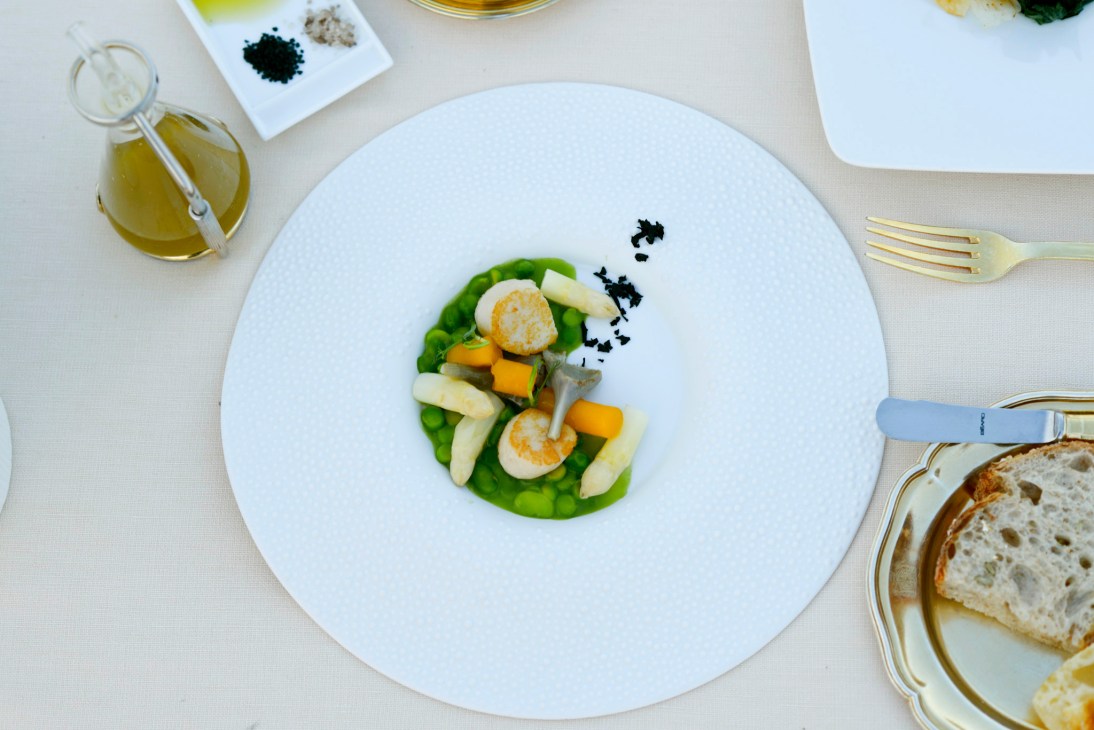 Plated egg gnocco with scallops, asparagus, peas and broad beans at La Pergola restaurant.