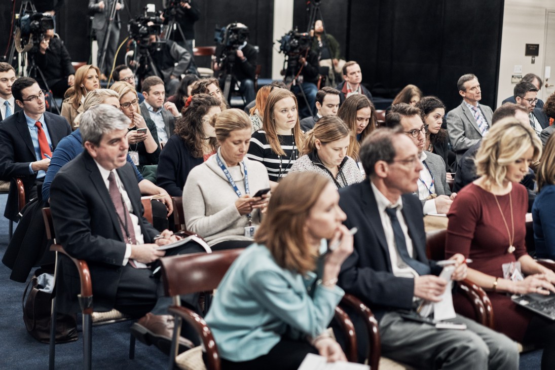PBS Newshour staff members and journalists in audience seating during Speaker Paul Ryan's press conference.
