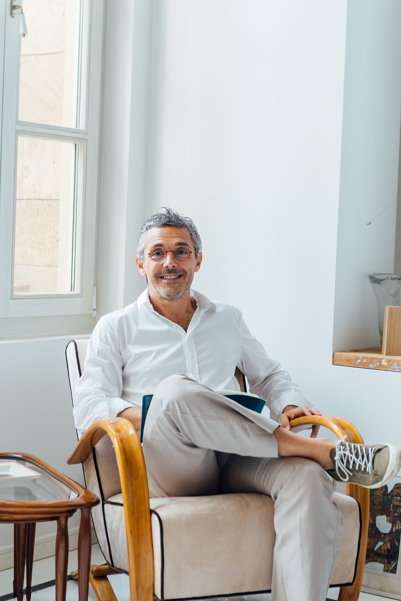 Selim Mouzannar, a jewellery designer, sits in a bright modern office space.