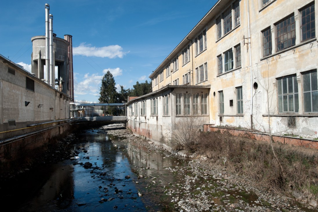 Reda textile mill in Biella, Italy, showing industrial buildings beside a stream.