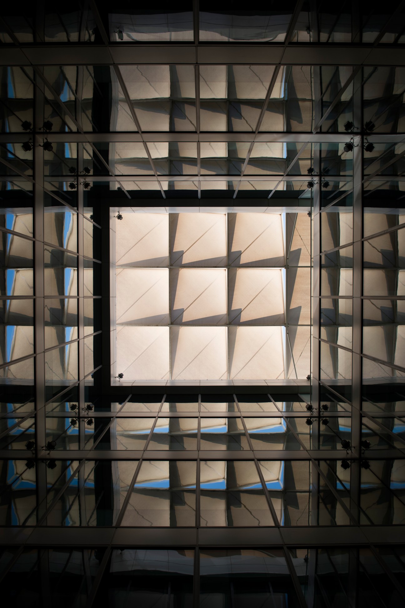 Interior view of Siemens headquarters showing geometric skylight with translucent panels and metal framework.