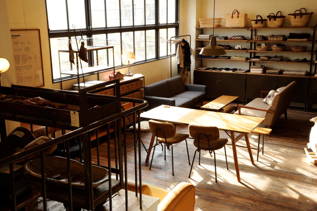 Truck's showroom displaying furniture, homewares, clothing, scarves and bags on shelves and throughout the space.