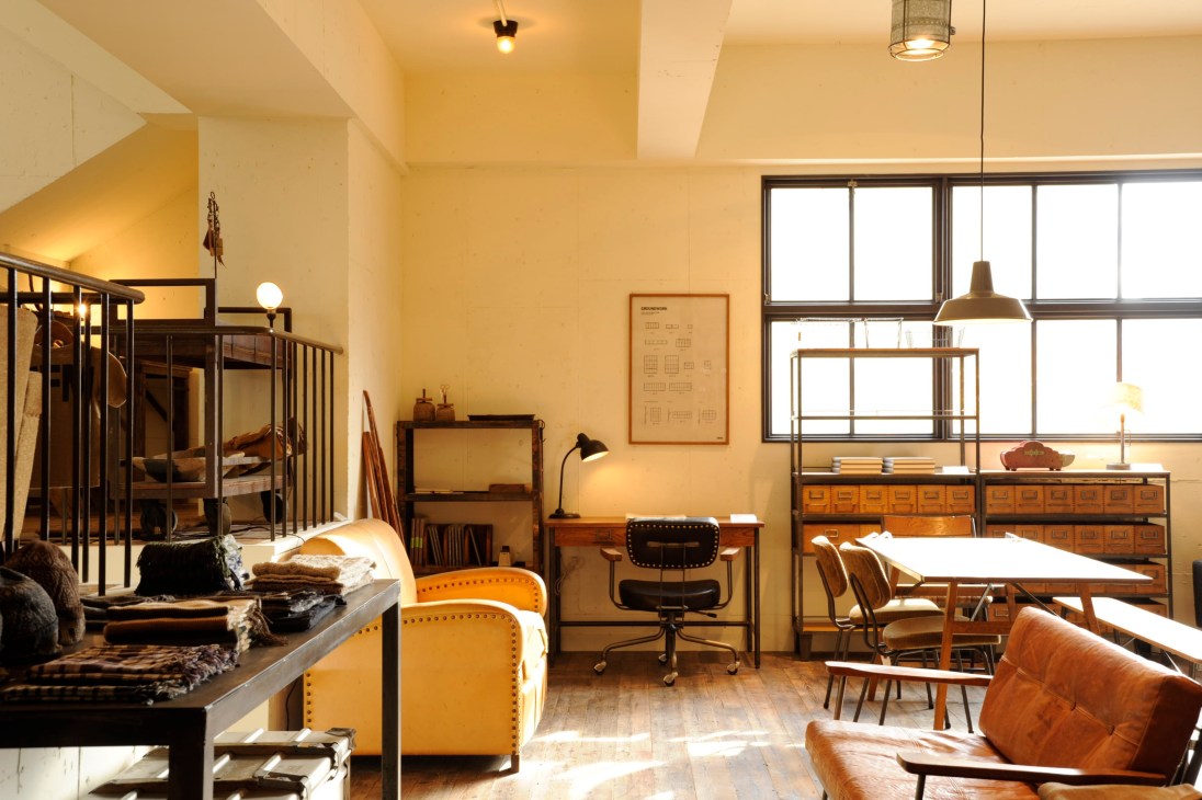 Truck showroom displaying furniture arranged in a home-like setting with natural light from large windows.