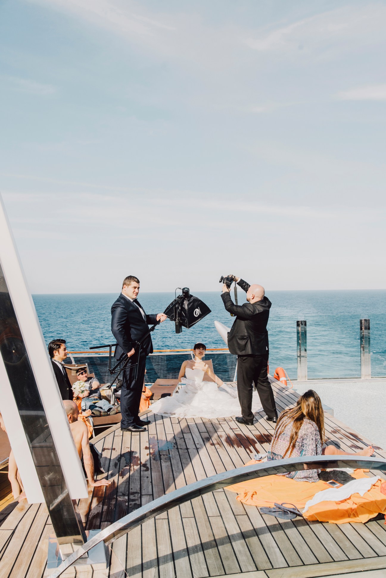 Wedding ceremony on MSC Preziosa's deck with bride, groom, and guests overlooking the sea.