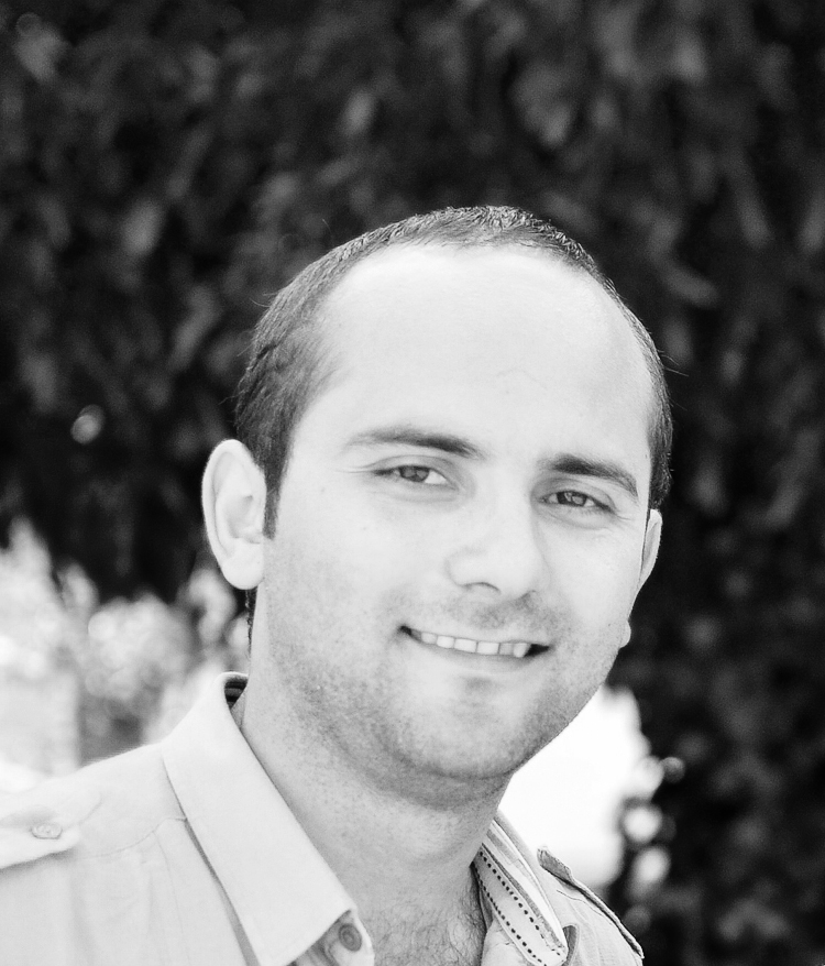 Black and white portrait photograph of Tayfun Kahraman, a Turkish protest activist and civil servant.