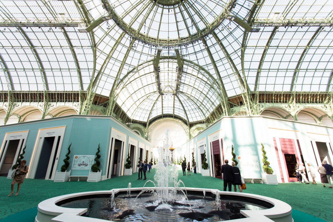 A decorative fountain sprays water in the centre of the Grand Palais's glass-roofed exhibition hall during the Biennale des Antiquaires.