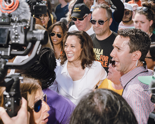 Kamala Harris surrounded by media and supporters at Iowa State Fair