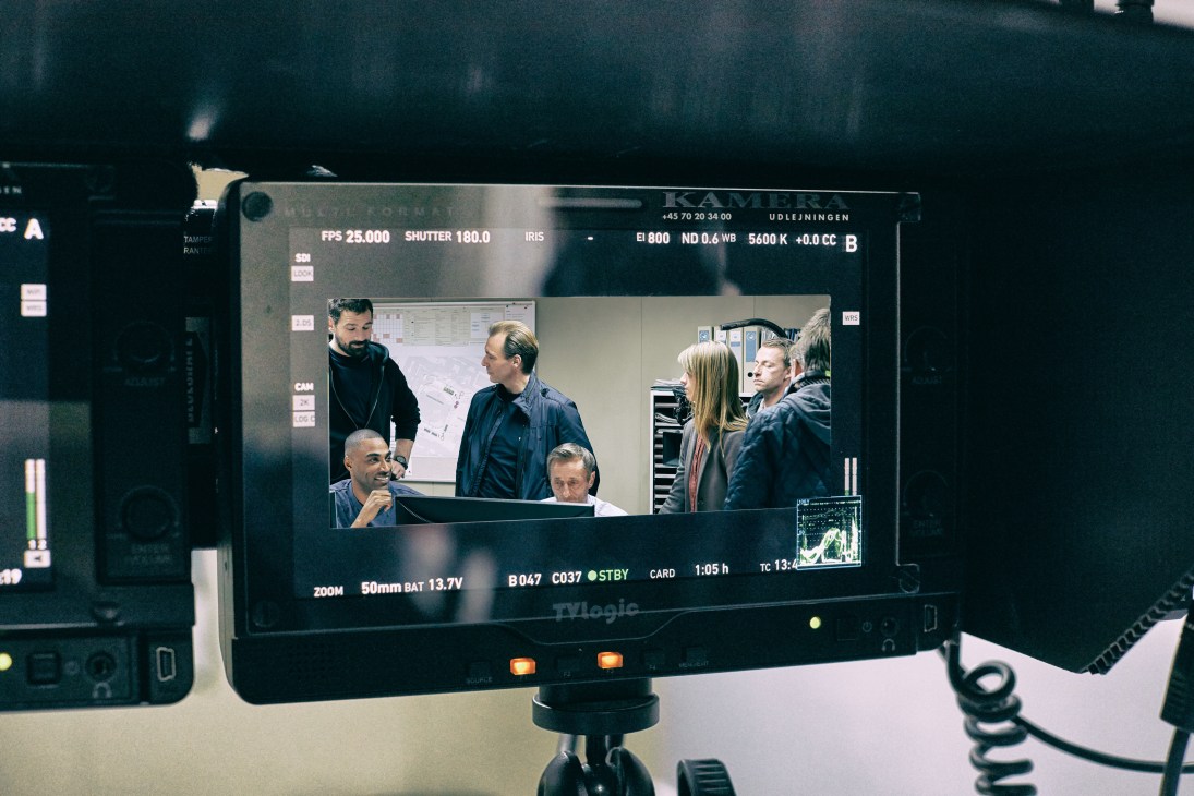Monitor display shows actors and crew preparing a scene for Below the Surface Danish television series.