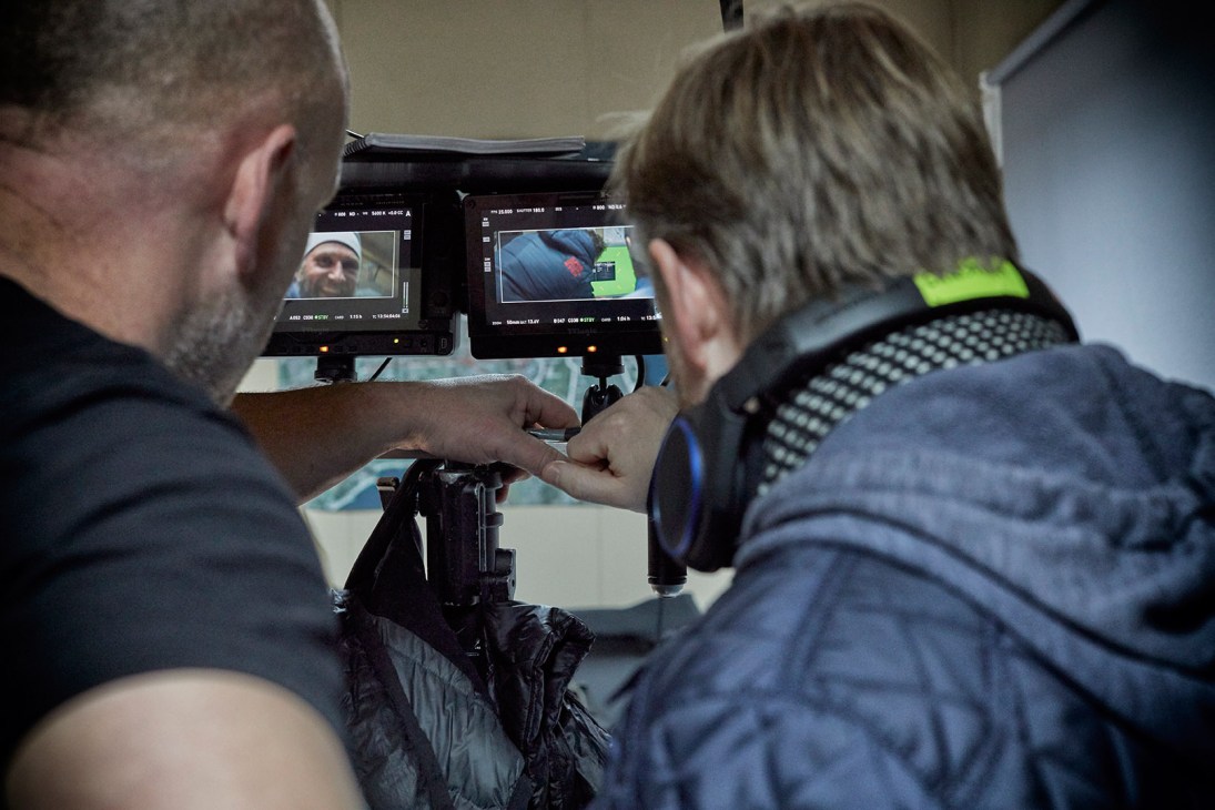 Crew members review footage on monitoring screens during Below the Surface production.